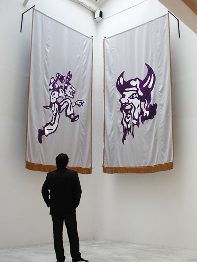 <i>The Kiel Raiders</i>, 2002, installation with two banners, overall: 144 x 76 inches (366 x 193 cm)