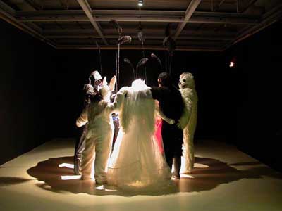 <i>Les Gras</i>, 2003, installation with nine mannequins: resin, costumes, accessories, overall: 98 7/16 x 118 1/8 x 118 1/8 inches (250 x 300 x 300 cm)