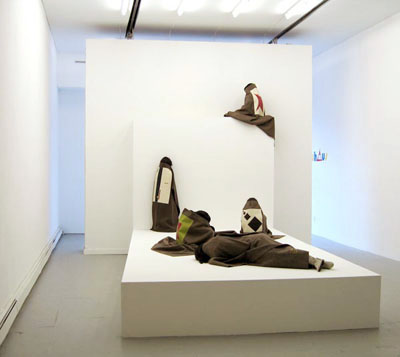 <i>Bauhaus</i>, exhibition view, Parker's Box, 2006, installation with five mannequins: platform, resin, military blanket, overall: 146 x 196 x 196 inches (370.8 x 246.4 x 487.8 cm), photo credit: Claire Lesteven