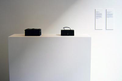 <i>Provenance</i>, exhibition view, medievalmodern, London, United Kingdom, 2002, <i>Untitled</i>, 2002, installation with two elements, left to right: Spanish medieval oak box, 6 x 3 x 7 inches (15 x 8 x 18 cm); contemporary African leather covered box, 6 x 3 x 4 inches (15 x 8 x 9 cm)