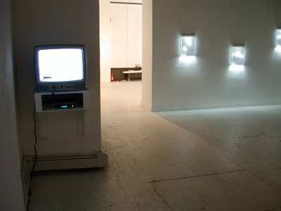 Exhibition view from left to right:  installation view of <i>Escape Vehicle no7</i>, 2005, video still, Mpeg files + DVD, 7 min, edition of 5; series <i>Antarctica Dispatches</i> etched drawing on acrylic mounted in light housing, edition of 5, 17x12 ins (43x30.5 cm) each